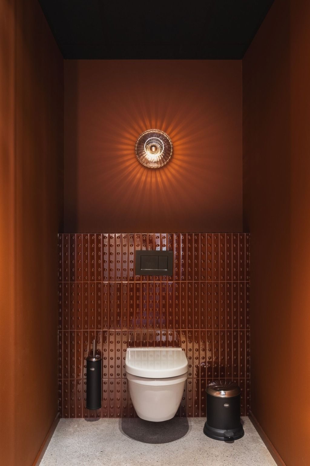 Warm terracotta-tiled bathroom with ambient light